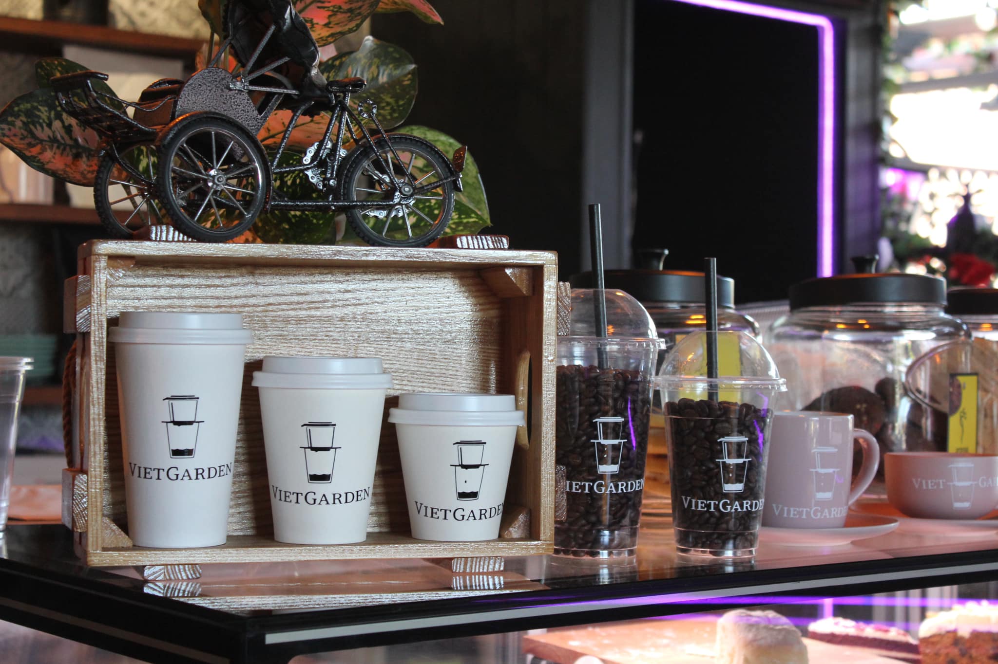 VietGarden branded coffee cups and beans on counter