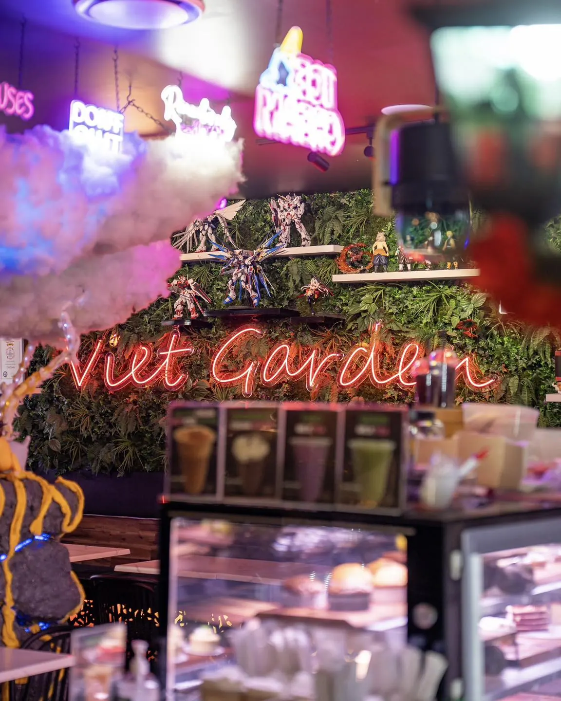 VietGarden cafe interior neon sign and anime figurine display Richlands